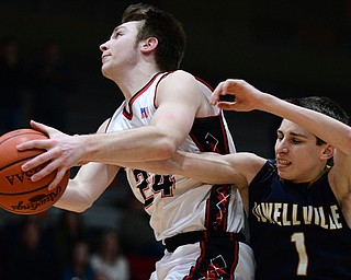 STRUTHERS, OHIO - FEBRUARY 19, 2019: Struthers' Trey Metzka grabs a rebound away from Lowellville's Micah Mamula-Zarlingo during the first half of their game, Tuesday night at Struthers High School. Lowellville won 55-48. DAVID DERMER I THE VINDICATOR