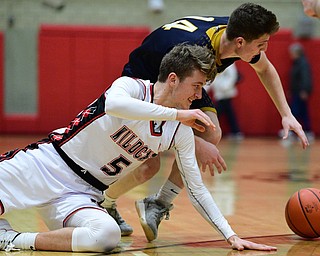 STRUTHERS, OHIO - FEBRUARY 19, 2019: Struthers' Carson Ryan reaches for the ball after Lowellville's Matt Hvisdak knocked it from his control during the second half of their game, Tuesday night at Struthers High School. Lowellville won 55-48. DAVID DERMER I THE VINDICATOR