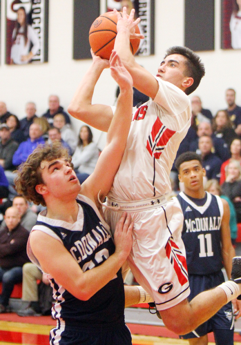 William D. Lewis The Vindictor  Girard's Austin Claussell(2) shoots over McDonald'sRyan Scala(22) during 2-20-19 action at Girard.
