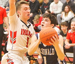 William D. Lewis The Vindictor  McDonald's Zach Rasile(1) shoots psat Girard's Adam Connelley(1)during 2-20-19 action at Girard.