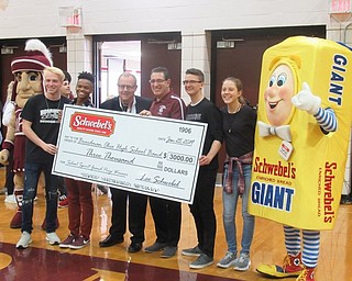 Neighbors | Jessica Harker.Lee Schwebel, the vice president of Schwebel Baking Company, presented Boardman Band Director Thomas Ruggieri with a $3,000 check for winning a school spirit competition.