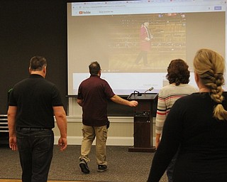 Neighbors | Abby Slanker.Librarian and line dance instructor Stuart Gibbs led attendees in learning to line dance at the Canfield library on Jan. 24.