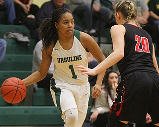 William D. Lewis The Vindicator   Ursuline's Dayshanette Harris(1) passes around Struthers' Renee Leonard(20).