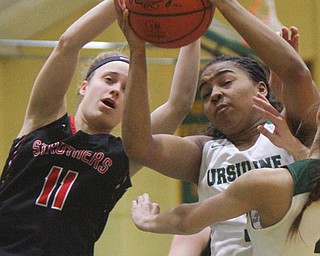 William D. Lewis The Vindicator   Ursuline's Dayshanette Harris(1) and Struthers'Emma Elia(11) battle for the ball.