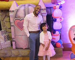 Neighbors | Jessica Harker.Jarrale and Kalenah Butts posed for a photo on Feb. 14 during the Daddy Daughter Dance hosted by Boardman Park.
