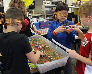 Neighbors | Abby Slanker.A group of C.H. Campbell Elementary School fourth-graders competed in an Orbeez scavenger hunt, during which they were blindfolded and had to use their hands to find objects from a designated list in a tub filled with hundreds of Orbeez at the school’s annual Valentine parties on Feb. 13. .