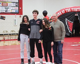 Neighbors | Abby Slanker.Canfield High School senior wrestler Aidan Burscak was escorted by his family during Senior Night on Feb. 13.