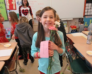 Neighbors | Jessica Harker.Grace Justice showed off the carnations she purchased, each for $1, at the Poland Union Elementary School's Valentine's Day parties.