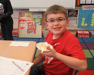 Neighbors | Jessica Harker.Poland Union Elementary School student Kevin Coss enjoyed an ice cream sundae provided by the school's PTO for the annual Valentine's Day celebration on Feb. 14.