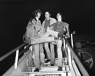 American pop group, the Monkees, pictured on arrival at London Airport, 28th June, 1967. Arriving from Paris, the group will perform a live stage show at the Empire Pool, Wembley, this coming weekend. Left to right are Davy Jones, Peter Tork, Micky Dolenz and Mike Nezsmith. (AP photo).