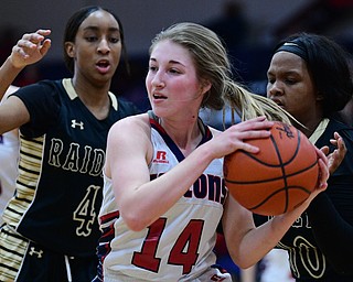 AUSTINTOWN, OHIO - FEBRUARY 21, 2019: Fitch's Emma Bartlett grabs a rebound away from Harding's Nalida McQueen, left, and Gia Green during the first half of their sectional finals game, Thursday night at Austintown Fitch School. Fitch won 49-33. DAVID DERMER I THE VINDICATOR