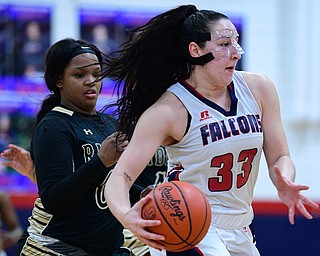 AUSTINTOWN, OHIO - FEBRUARY 21, 2019: Fitch's Sabria Hunter drives on Harding's Gia Green during the second half of their sectional finals game, Thursday night at Austintown Fitch School. Fitch won 49-33. DAVID DERMER I THE VINDICATOR