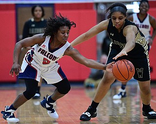 AUSTINTOWN, OHIO - FEBRUARY 21, 2019: Fitch's Jada Lazara knocks the ball away from Harding's Idea Phillips during the second half of their sectional finals game, Thursday night at Austintown Fitch School. Fitch won 49-33. DAVID DERMER I THE VINDICATOR