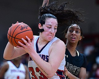 AUSTINTOWN, OHIO - FEBRUARY 21, 2019: Fitch's Sabria Hunter goes to the basket against Harding's Nalida McQueen during the second half of their sectional finals game, Thursday night at Austintown Fitch School. Fitch won 49-33. DAVID DERMER I THE VINDICATOR