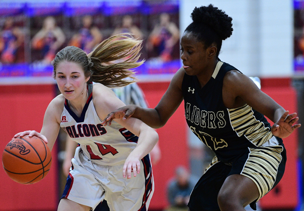 AUSTINTOWN, OHIO - FEBRUARY 21, 2019: Fitch's Emma Bartlett drives on Harding's Kamarah Bender during the second half of their sectional finals game, Thursday night at Austintown Fitch School. Fitch won 49-33. DAVID DERMER I THE VINDICATOR