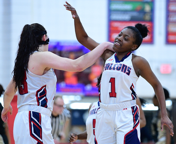 AUSTINTOWN, OHIO - FEBRUARY 21, 2019: Fitch's Mia Jackson, right, celebrates with Sabria Hunter after defeating Harding 49-33 in their sectional finals game, Thursday night at Austintown Fitch School. DAVID DERMER I THE VINDICATOR