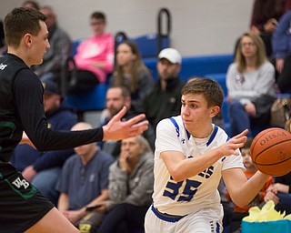 Hubbard's Nick Matisi looks to pass the ball while West Branch's Nick Everett tries to block him during their game at Hubbard on Friday night. EMILY MATTHEWS | THE VINDICATOR