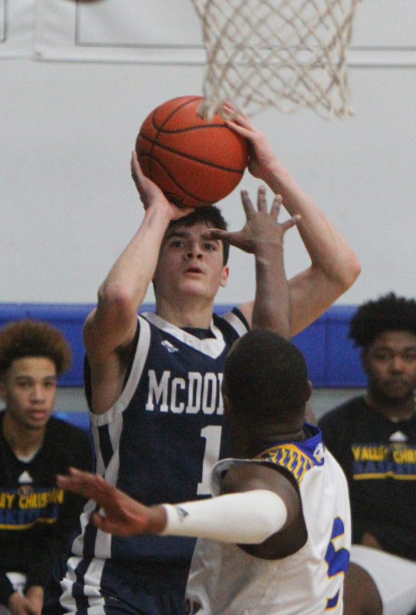 William D. Lewis The Vindicator  McDonald's Zach Rasile(1) shoots past Valley's Milan Square(5) during 2-22-19 action at Valley Christian.