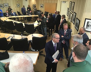 Gov. Mike DeWine has arrived and is greeting the Mahoning Valley mayors and others waiting for a roundtable discussion to begin at the Covelli Enterprises offices on East Market Street in Warren.