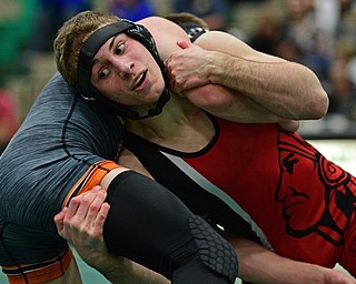 BELOIT, OHIO - FEBRUARY 23, 2019: Girard's Alex Delgarbino sprawls to take control of Marlington's Mason Mccarty during their 132lbs. Sectional Final Championship Bout, Saturday night at West Branch High School. DAVID DERMER | THE VINDICATOR