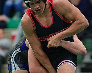 BELOIT, OHIO - FEBRUARY 23, 2019: Canfield's Ben Cutrer attempts to break free from the grasp of Poland's Justice Smith during their 170lbs. Sectional Final Championship Bout, Saturday night at West Branch High School. DAVID DERMER | THE VINDICATOR