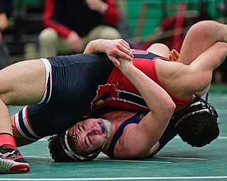 BELOIT, OHIO - FEBRUARY 23, 2019: Poland's Justice Smith wrestles with Canfield's Ben Cutrer during their 170lbs. Sectional Final Championship Bout, Saturday night at West Branch High School. DAVID DERMER | THE VINDICATOR