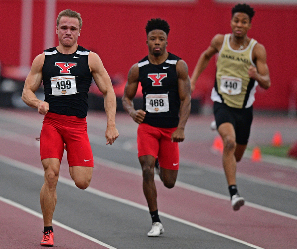 YOUNGSTOWN, OHIO - FEBRUARY 24, 2019: Youngstown State's Chad Zallow sprints ahead of Jamynk Jackson and Oakland's Marcus Nellum during the men's 200 meter dash final, Sunday afternoon at the Watt and Tressel Training Facility during the Horizon League Indoor Track Championship. DAVID DERMER | THE VINDICATOR
