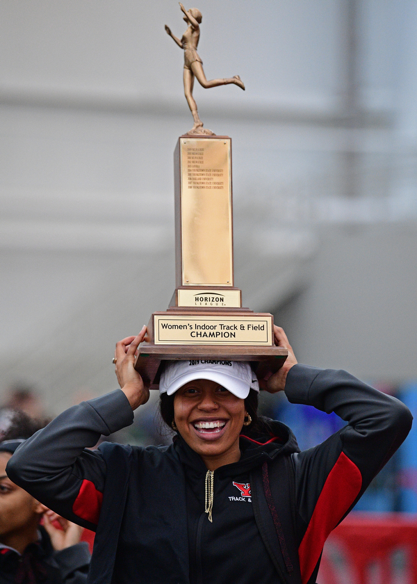 YOUNGSTOWN, OHIO - FEBRUARY 24, 2019: Youngstown State's Chontel Fils celebrates with a championship trophy after Youngstown State won the women's indoor championship, Sunday afternoon at the Watt and Tressel Training Facility during the Horizon League Indoor Track Championship. DAVID DERMER | THE VINDICATOR