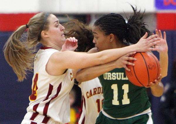 William D. Lewis The Vindicator  Ursuline Dayshanette Harris(11) keeps the ball from Mooney'sCaitlin Perry(44).