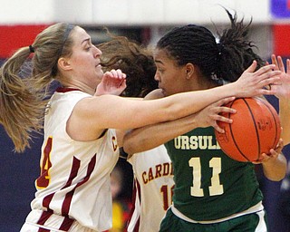 William D. Lewis The Vindicator  Ursuline Dayshanette Harris(11) keeps the ball from Mooney'sCaitlin Perry(44).