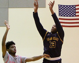 William D. Leiws The Vindicator  East's Carl Sadler(13) sinks a 3 pointer against Chaney's Ryan Clark(4) during 1rst half action 2-26-19 at Chaney.