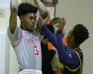 William D. Leiws The Vindicator Chaney's Marquell Gillispie(3) looks to pass around East's Chris McCullough(12)during 1rst half action 2-26-19 at Chaney.