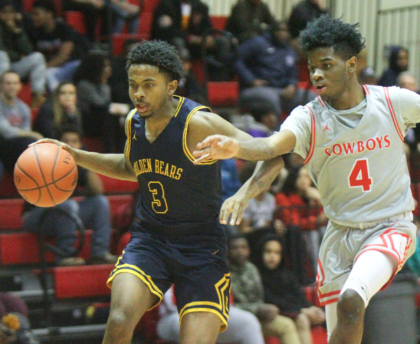 William D. Leiws The Vindicator  East's Deland Richardson(3) drives past Chaney's Ryan Clark(4) during 1rst half action 2-26-19 at Chaney.