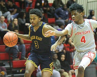 William D. Leiws The Vindicator  East's Deland Richardson(3) drives past Chaney's Ryan Clark(4) during 1rst half action 2-26-19 at Chaney.