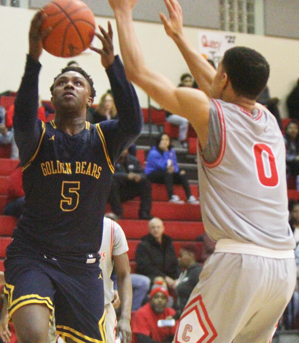 William D. Leiws The Vindicator  East's Mar'Quel Anderson(5) shoots past Chaney's Sharrod Taylor(0) during 1rst half action 2-26-19 at Chaney.