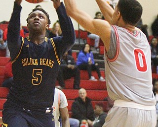 William D. Leiws The Vindicator  East's Mar'Quel Anderson(5) shoots past Chaney's Sharrod Taylor(0) during 1rst half action 2-26-19 at Chaney.