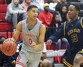 William D. Leiws The Vindicator Chaney's Sharrod Taylor(0) drives around East's Carl Sadler(13) during 1rst half action 2-26-19 at Chaney.