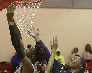 William D. Leiws The Vindicator  Chaney's Quincey Jones(22) scores past East's Carl Sadler(13) during 1rst half action 2-26-19 at Chaney.