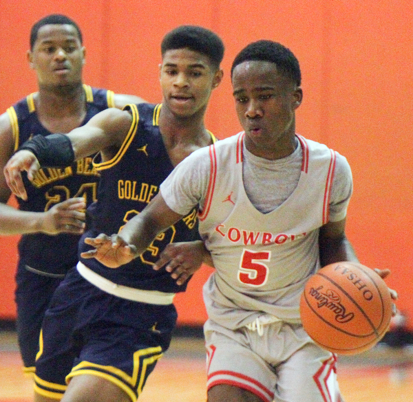 William D. Leiws The Vindicator Chaney's Mar'Quel Anderson(5) drives around East's Gabriel Green(23)during 1rst half action 2-26-19 at Chaney.