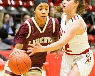 William D. Lewis The Vindicator Liberty's Sharda Williamson(1)  drives around Salem's Ellie Davidson(12) during 2-27-19 action at Struthers.