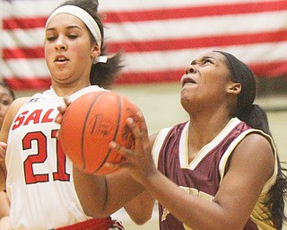 William D. Lewis The Vindicator Liberty's Delia watson(5) shoots past Salem'sEcho Mayer-Kurtz(21)  during 2-27-19 action at Struthers.