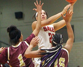 William D. Lewis The VindicatorSalem's Echo Mayer-Kutz(21) shoots over Liberty's Sharda Williamson(1) and Zionne Newkirk (15) during 2-27-19 action at Struthers.