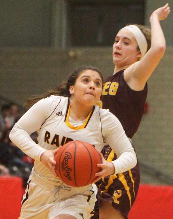 William D. Lewis The VindicatorSouth Range's Bri Modic(11) drives around South East's Emma Keto(12) during 2-27-19 action at Struthers.