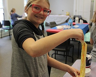 Neighbors | Abby Slanker.Payton Konnerth, of Boardman, mixed up fluffy slime during the Canfield library’s Slime Time for Tweens on Jan. 26.