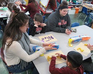 Neighbors | Jessica Harker.Boardman High School students teamed up with kindergartner's from Robinwood Elementary School, helping them shape letters and numbers in playdough for the Big Spartan Little Sparten program on Feb. 1.