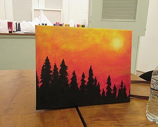 Neighbors | Jessica Harker.Pictured is a painted canvas done by librarian Adrian Zupcsan for community members to use as an example during the Art with Andrea event.