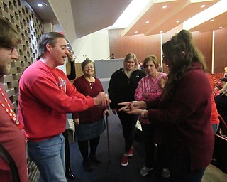 Neighbors | Jessica Harker.Austintown Fitch teachers Steve Ward and Lynette Seebacher face off in rock, paper, scissors during the Stanley Leone speech Feb. 14 at the schools auditorium.