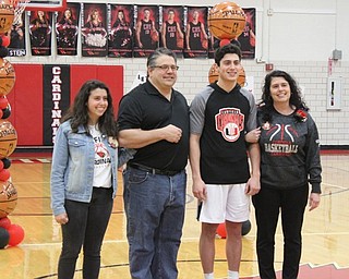 Neighbors | Abby Slanker.Canfield High School senior basketball player Conor Crogan was escorted by his family during Senior Night on Feb. 8.
