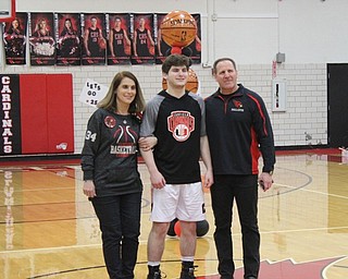 Neighbors | Abby Slanker.Canfield High School senior basketball player Luke Pallante was escorted by his parents during Senior Night on Feb. 8