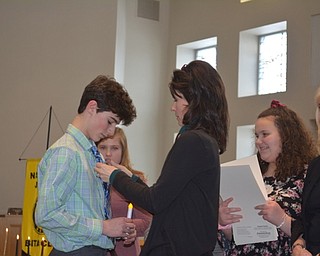 Neighbors | Submitted.Holy Family eighth-grade student Griffin Barton is pinned by mother, Shelly Barton, during the Beta Club installation on Jan. 28..